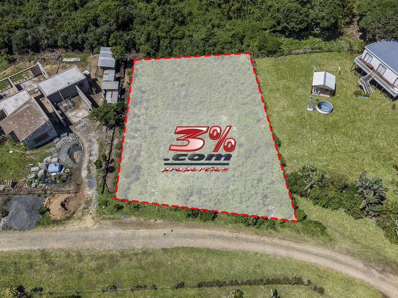 Aerial view of a vacant residential plot with clear boundary markings, situated in a developed neighborhood.