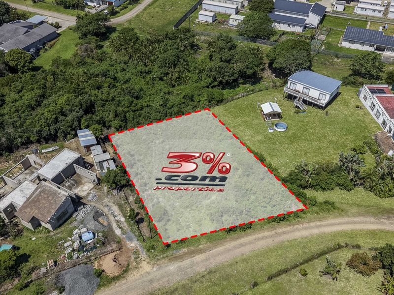 Aerial view of a vacant residential plot situated in a developed neighborhood, offering a clear space for potential construction.