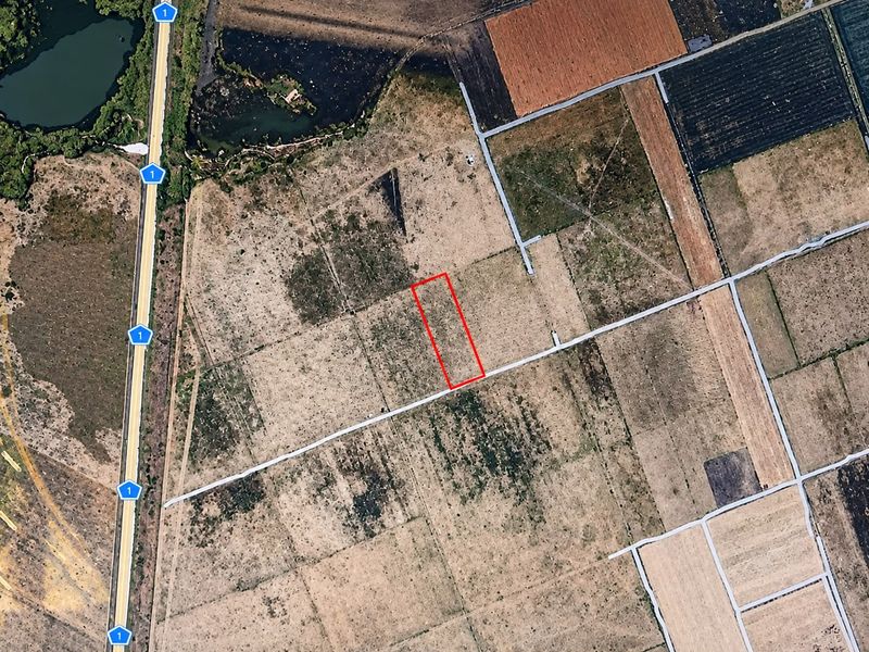 An aerial view showing the demarcated land parcel within a rural small holding area, highlighting its position relative to local access roads.