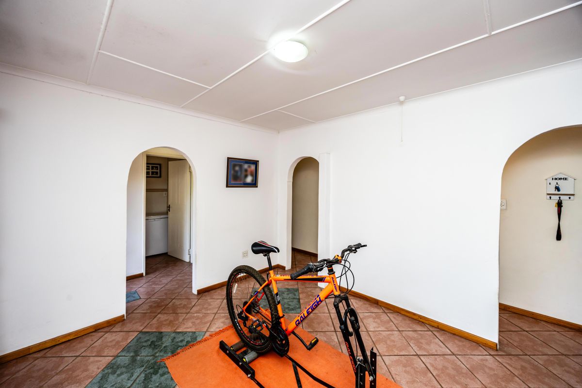 Ideal Family Home with Covered Patio, Pool, and Additional Flatlet - Photo 5