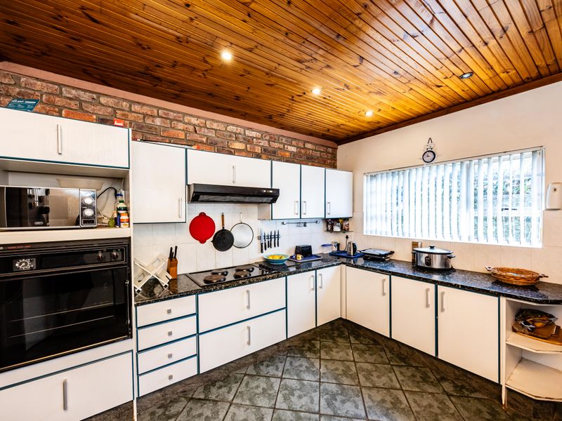 Ideal Family Home with Covered Patio, Pool, and Additional Flatlet - Photo 7