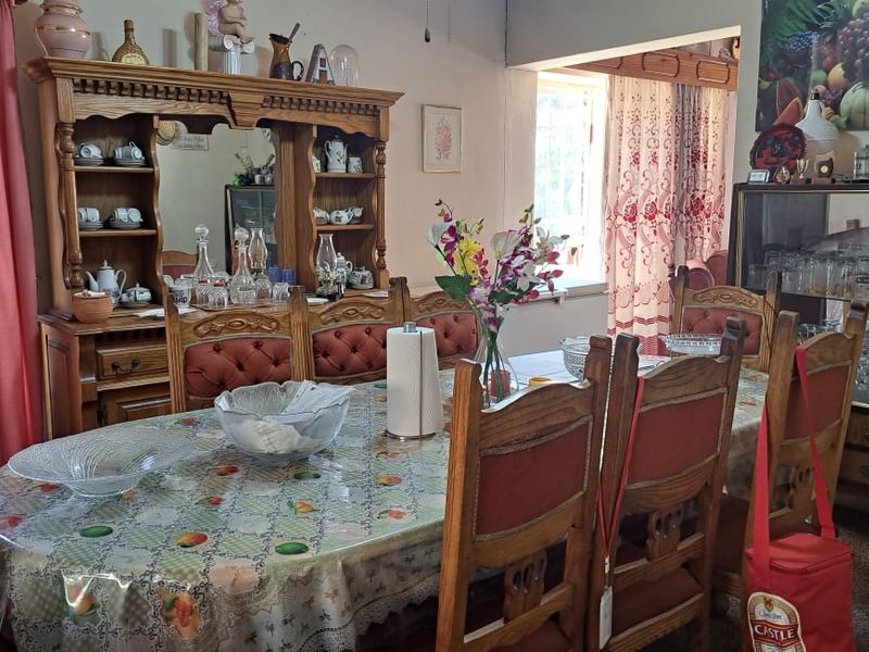 A traditional dining room space featuring a classic layout, suitable for family meals and gatherings.