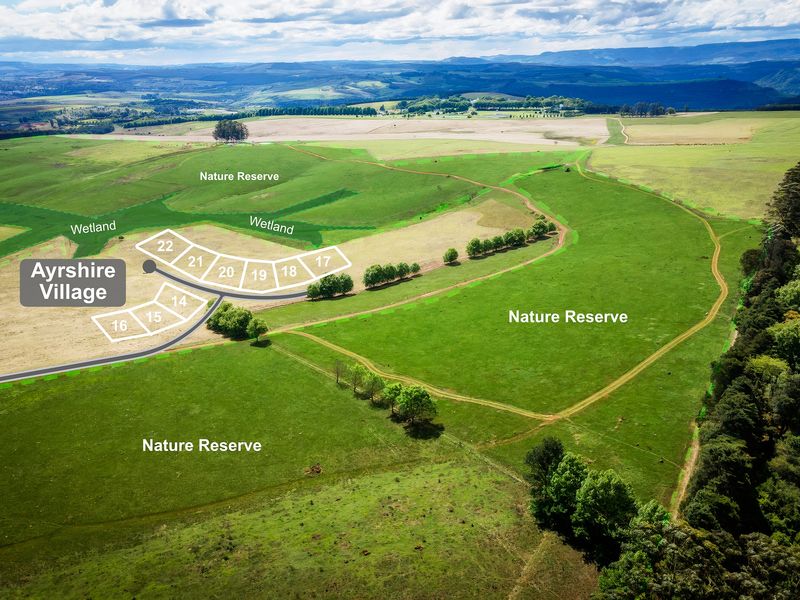 Aerial view of Ayrshire Village showing demarcated residential plots surrounded by expansive nature reserves and wetlands.