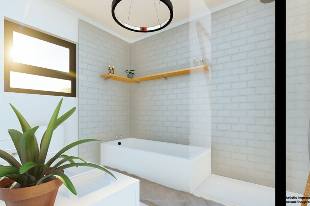 A modern bathroom featuring a built-in bathtub, glass shower screen, and subway tile wall finishes in a clean, contemporary design.