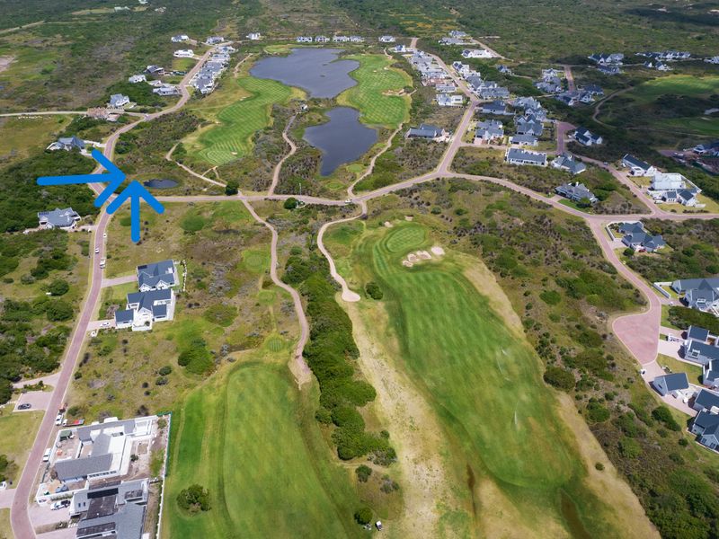 An aerial view of a residential golf estate showing the vacant plot location, surrounding fairways, and established neighborhood infrastructure.