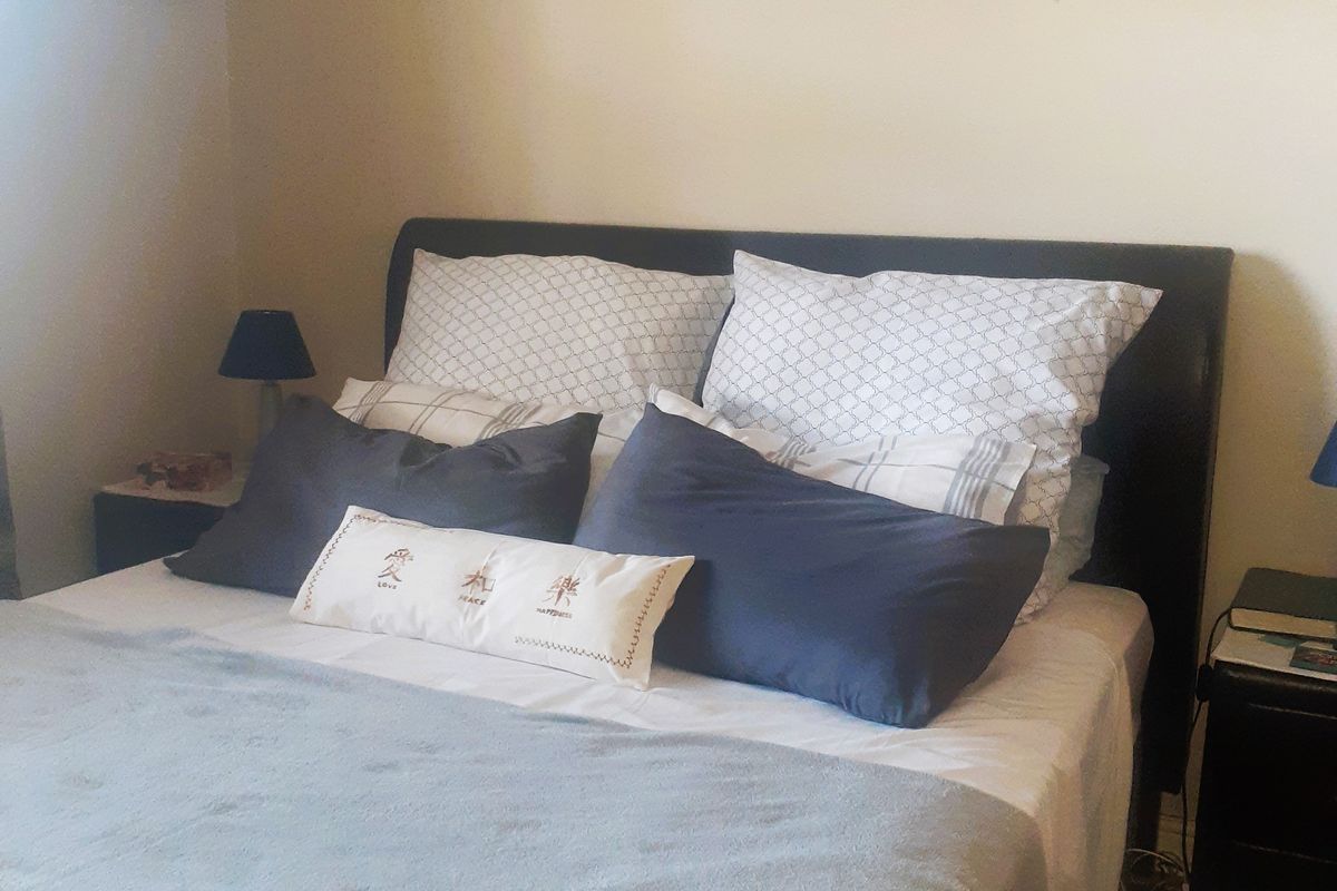 A standard bedroom featuring neutral wall finishes and space for a double bed.
