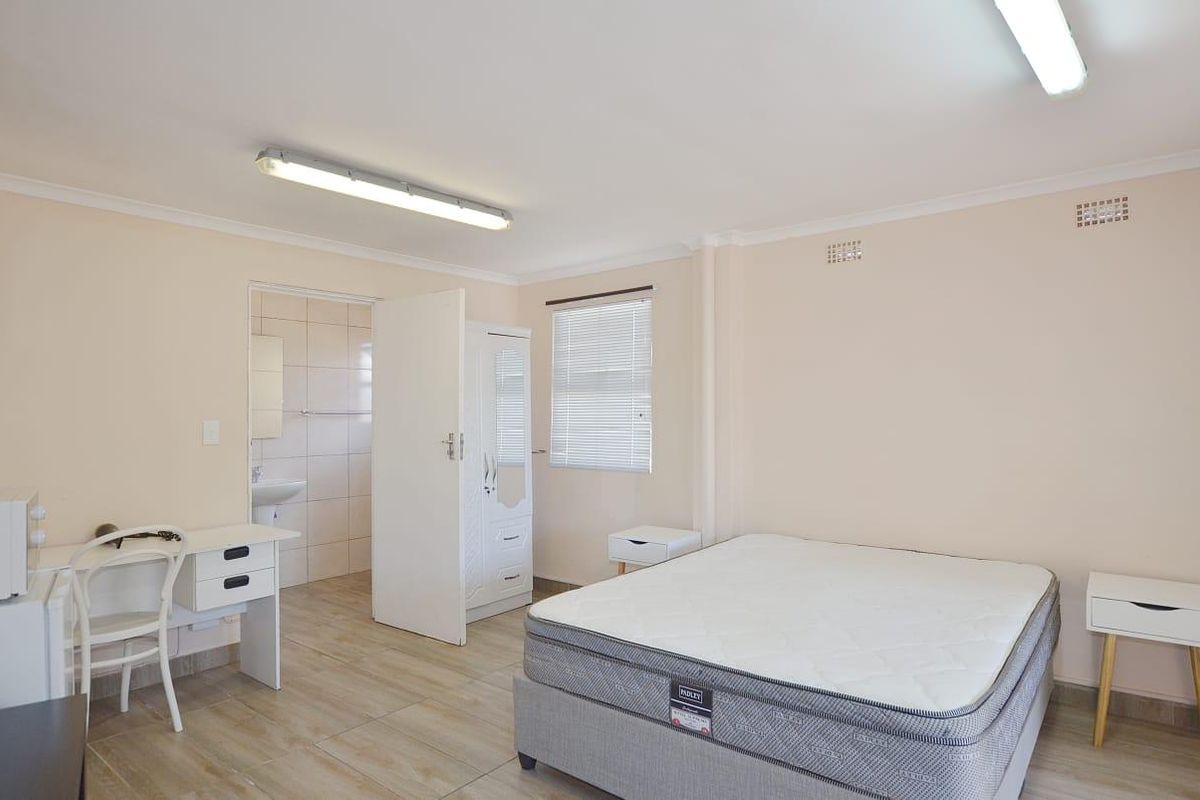 This unit forms part of a house with communal yard space and parking - Photo 2
