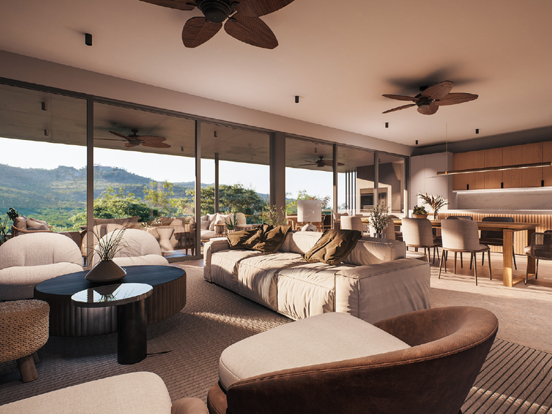 Spacious open-plan living and kitchen area featuring floor-to-ceiling glass doors, modern cabinetry, and ceiling fans, offering seamless indoor-outdoor flow with scenic views.