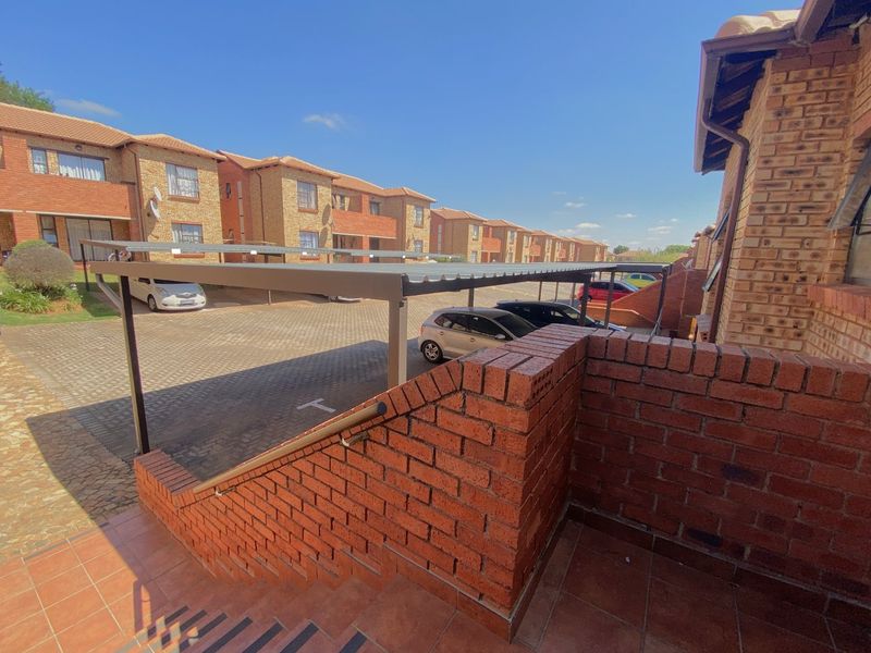 View from unit - Clubhouse with pool - Security - Photo 3