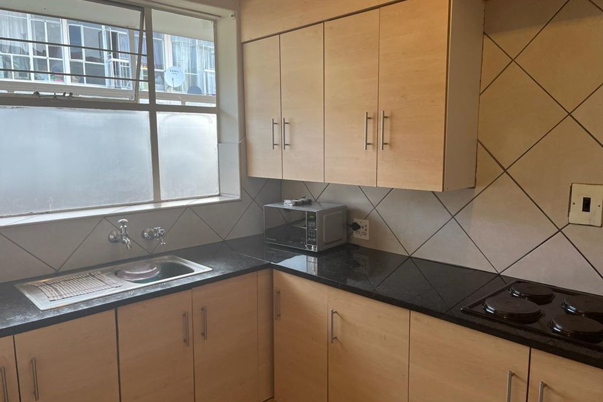 Spacious two bedroom unit in a tranquil complex - Photo 2
