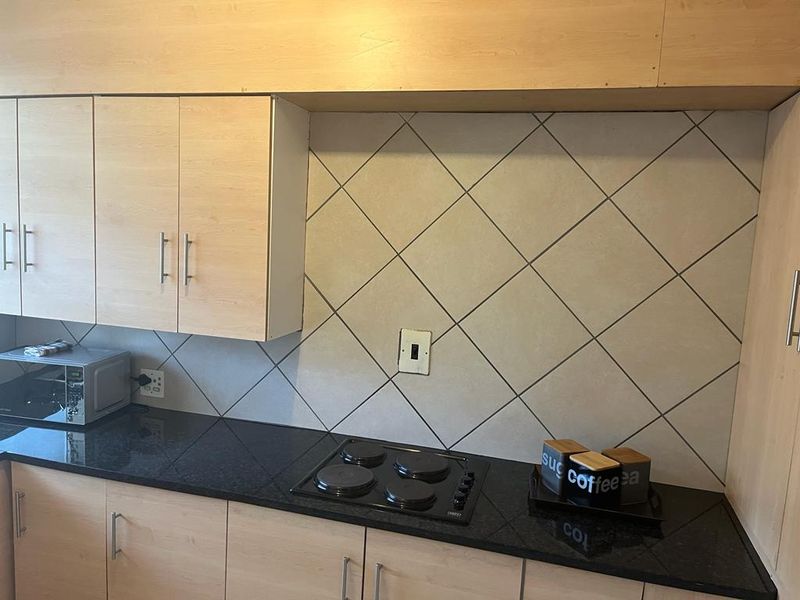 Spacious two bedroom unit in a tranquil complex - Photo 3