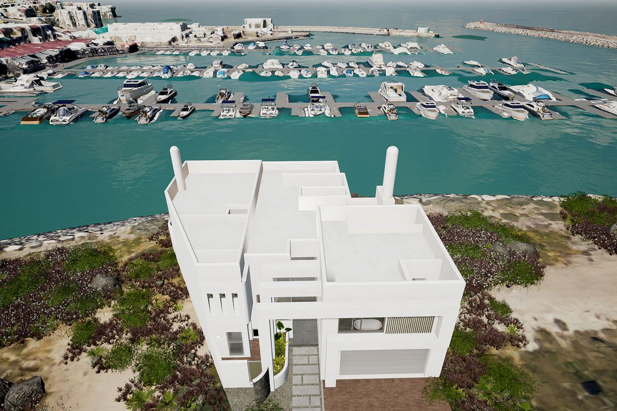 Aerial view of a modern white villa situated directly on the waterfront, featuring a flat roof design and proximity to a private marina.