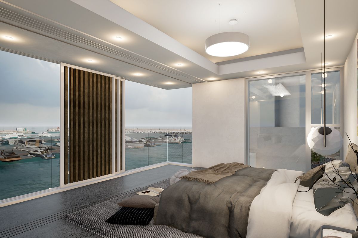 Modern luxury bedroom featuring polished concrete floors, recessed ceiling lighting, and expansive floor-to-ceiling glass doors offering panoramic marina and ocean views.