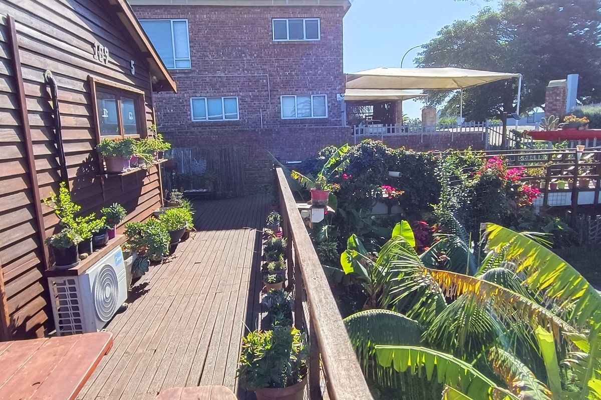 Walking Distance to the Beach with Two Rental Income Generating Flats! in Paradise Beach - Photo 2