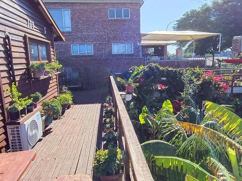 Walking Distance to the Beach with Two Rental Income Generating Flats! in Paradise Beach - Photo 2