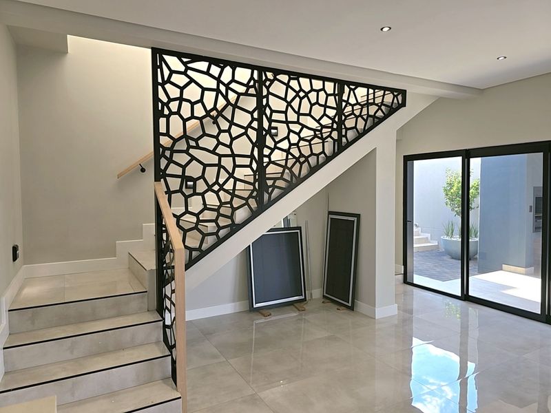 Modern 4-Bedroom, 3 Garage Home with Staff Room and Pool - Photo 9