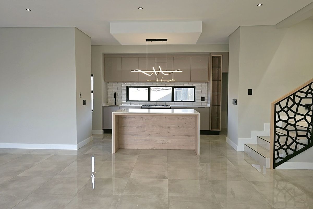 Modern 4-Bedroom, 3 Garage Home with Staff Room and Pool - Photo 5