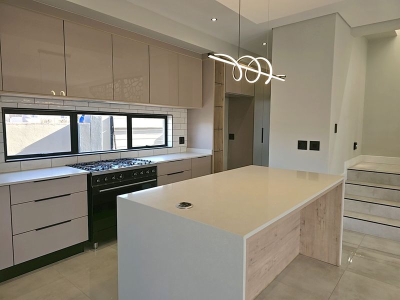 Modern 4-Bedroom, 3 Garage Home with Staff Room and Pool - Photo 6