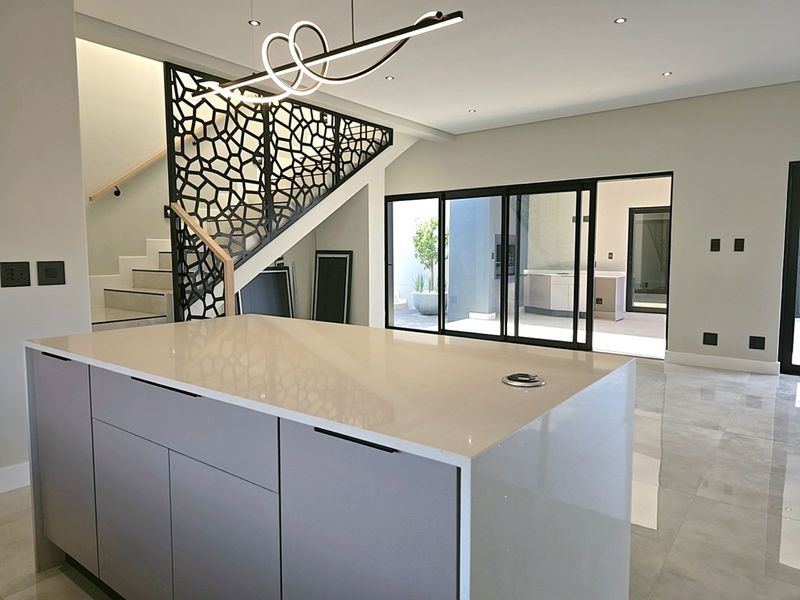 Modern 4-Bedroom, 3 Garage Home with Staff Room and Pool - Photo 3