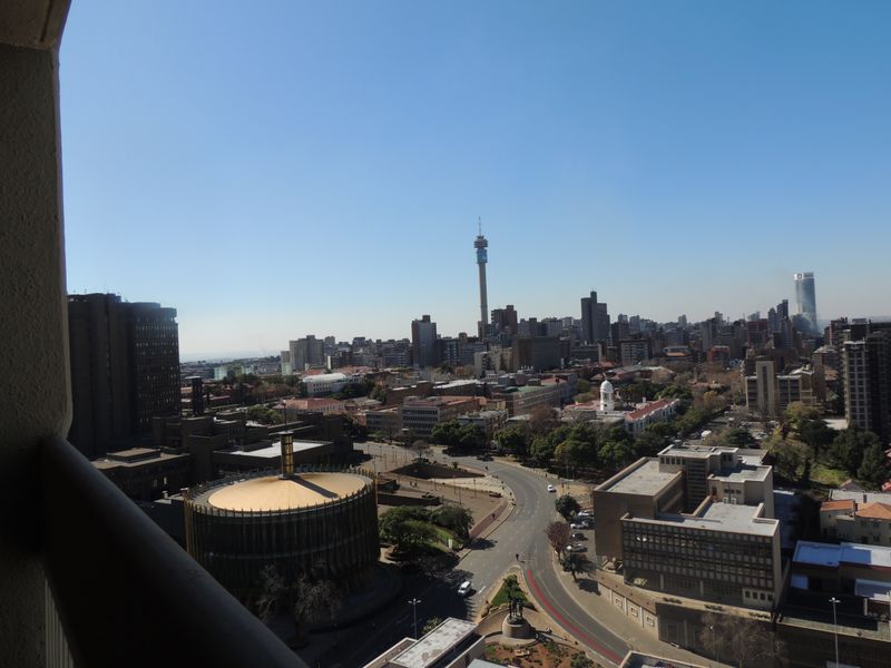 An elevated urban cityscape view overlooking the surrounding metropolitan area and skyline.