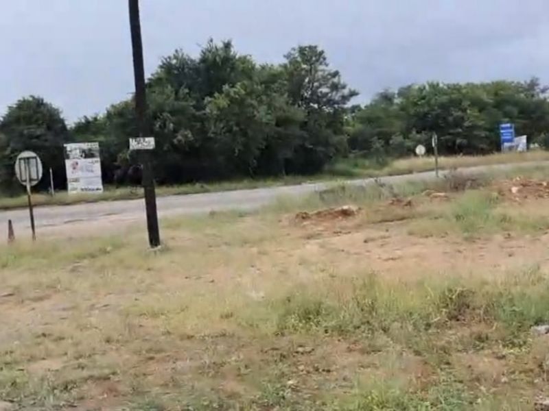 A view of the street frontage and surrounding landscape adjacent to the vacant residential land.