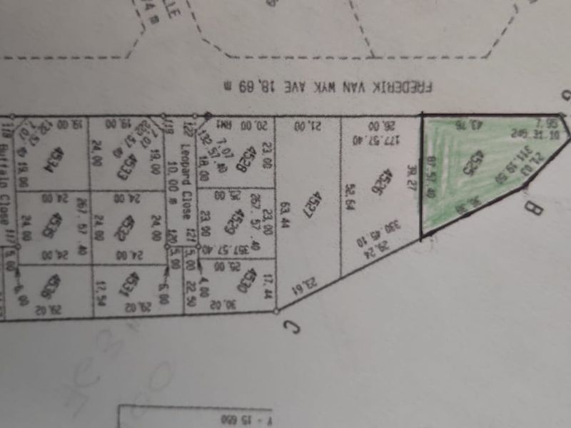 A cadastral survey map showing the layout and dimensions of residential land plots in the area.