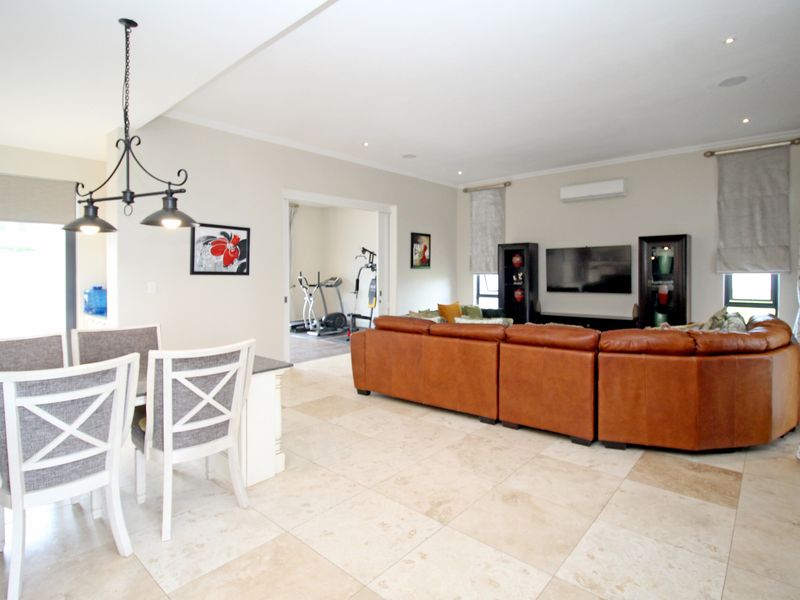 Opulent 5-Bedroom Estate with Expansive Gardens, Resort-Style Pool, Private Cinema, and Gym. - Photo 10