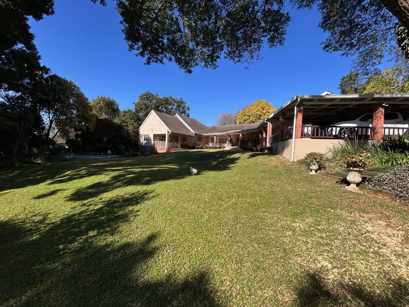 Elegant Garden Home with Income-Generating Cottages and Entertainment Spaces - Photo 4