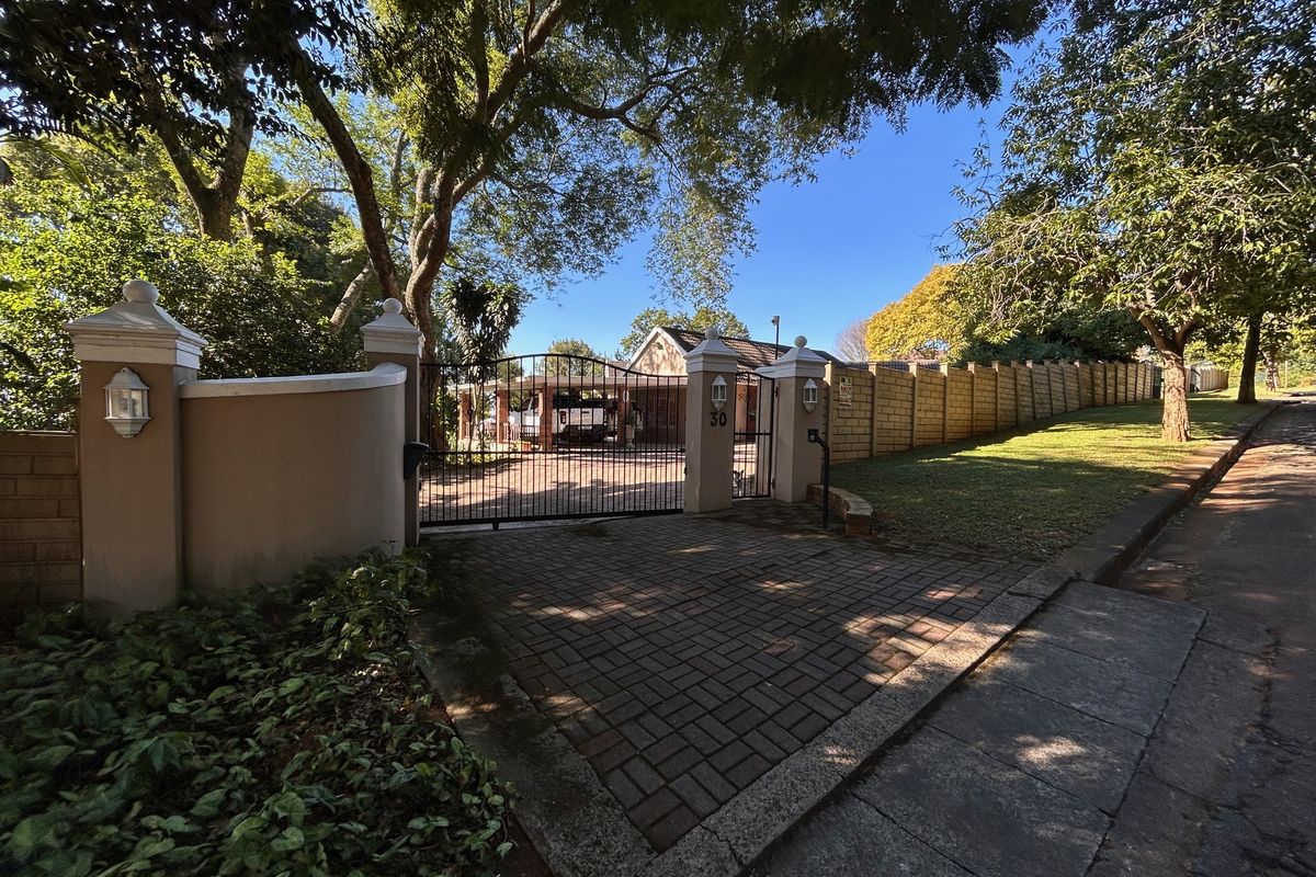 Elegant Garden Home with Income-Generating Cottages and Entertainment Spaces - Photo 2