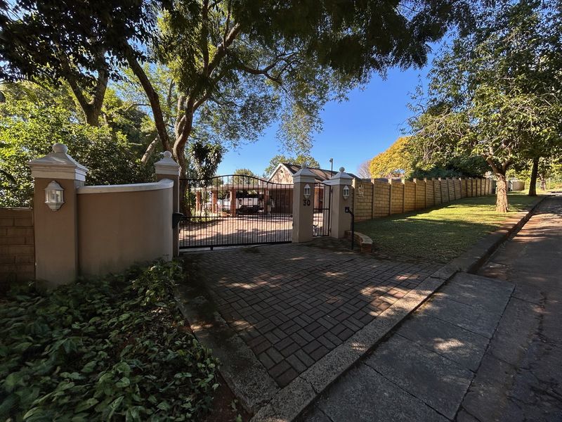 Elegant Garden Home with Income-Generating Cottages and Entertainment Spaces - Photo 2