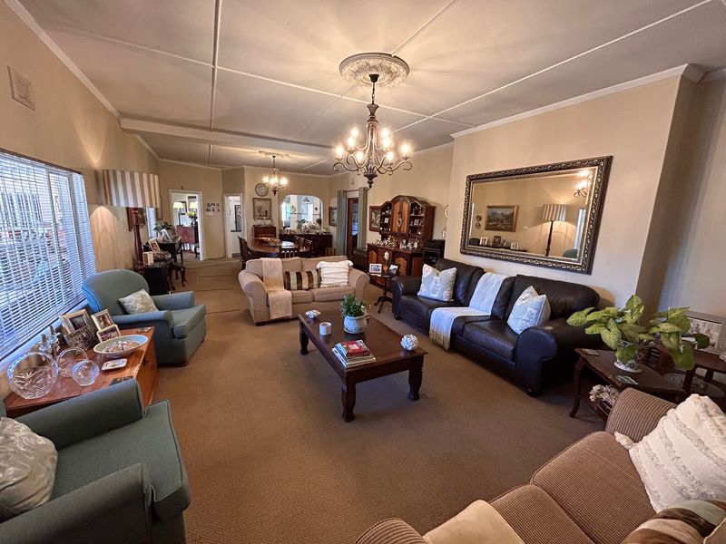 Elegant Garden Home with Income-Generating Cottages and Entertainment Spaces - Photo 10