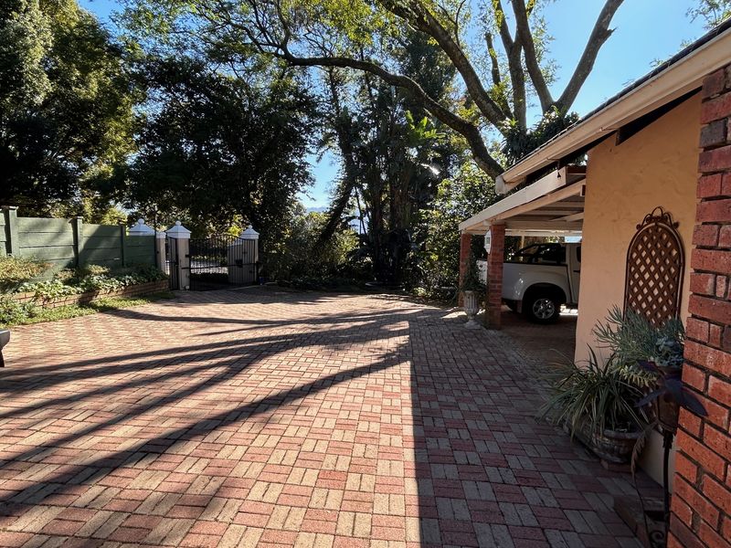 Elegant Garden Home with Income-Generating Cottages and Entertainment Spaces - Photo 8