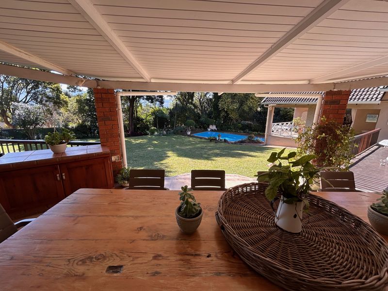 Elegant Garden Home with Income-Generating Cottages and Entertainment Spaces - Photo 6