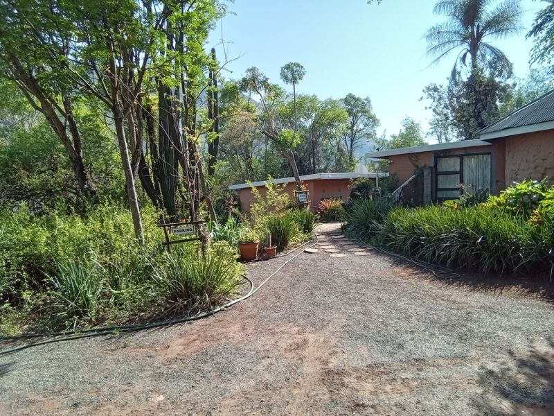 28 Ha valuable mountain land next to N4 Waterval Onder - Photo 4