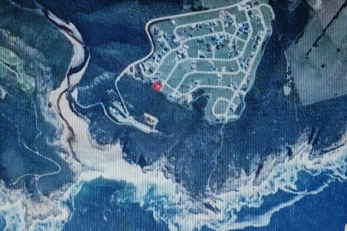 An aerial view showing the property location within the coastal estate, highlighting its proximity to the coastline and surrounding natural landscape.
