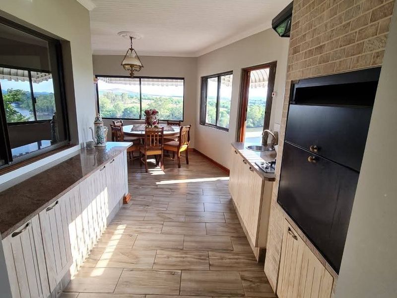 Spacious 5-Bedroom Home with River Views, Solar, and Top Security Features - Photo 4