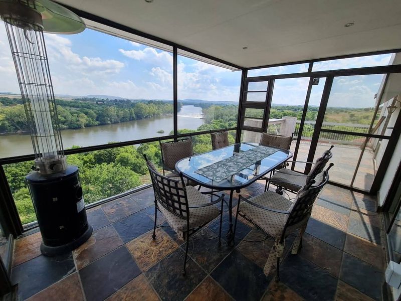 Spacious 5-Bedroom Home with River Views, Solar, and Top Security Features - Photo 2