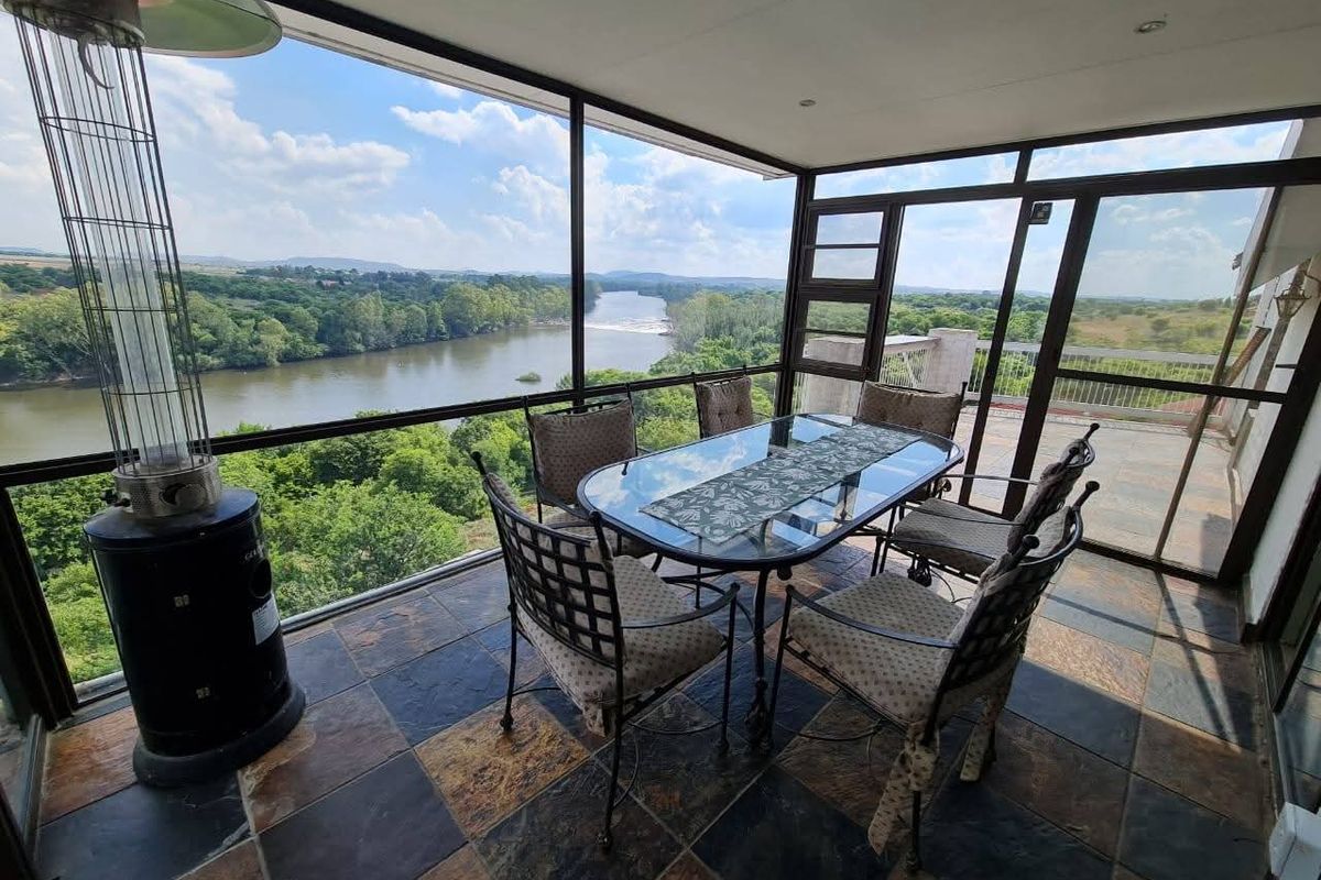 Spacious 5-Bedroom Home with River Views, Solar, and Top Security Features - Photo 2