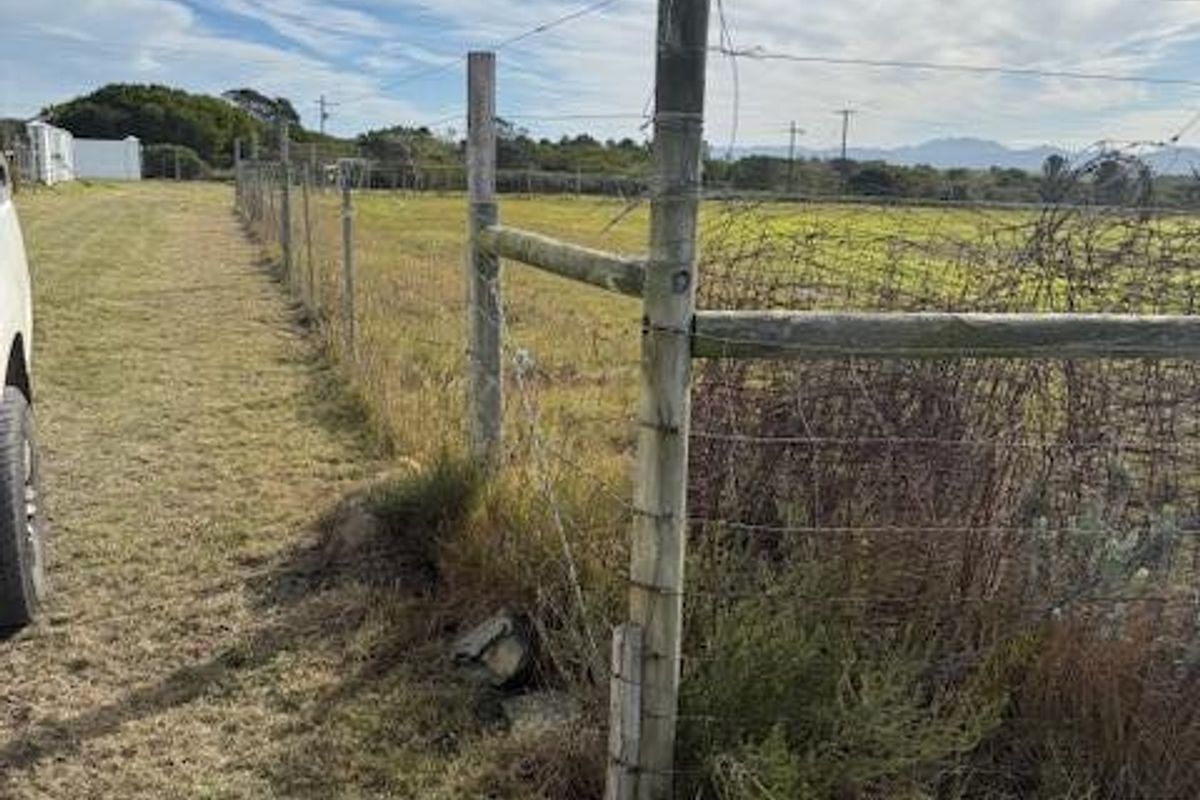 A view of the vacant residential land boundary featuring wire fencing and timber posts with surrounding natural vegetation.