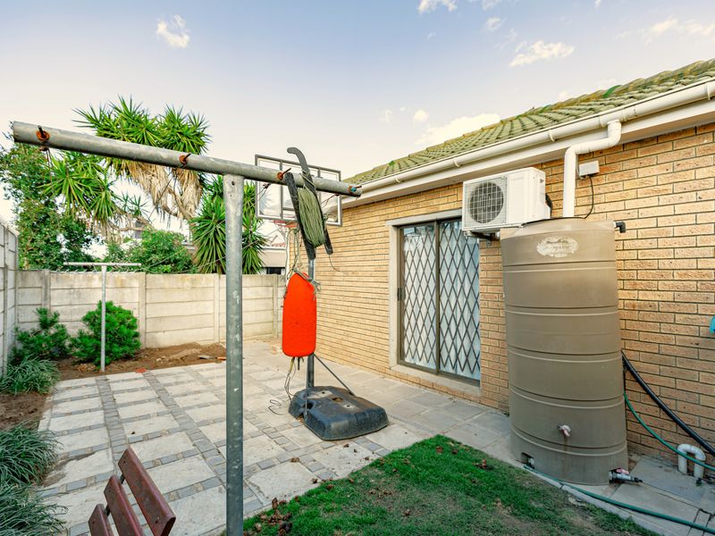 Face-Brick Family Home with Pool, Indoor Braai & Versatile 4th Bedroom - Photo 8