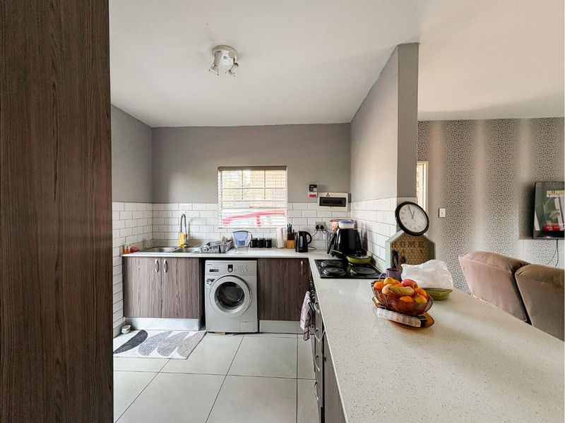 Charming 2-bed, 1.5-bath townhouse offering comfort, convenience & secure living. - Photo 2