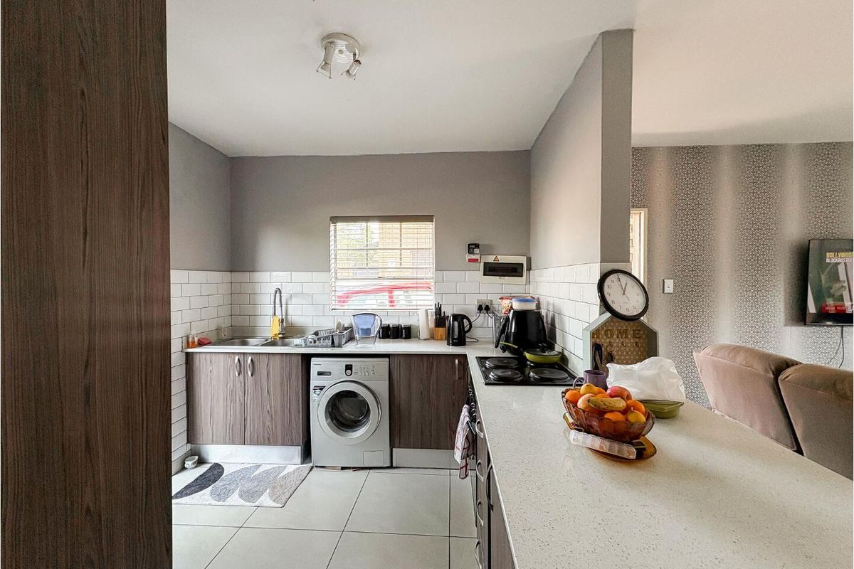 Charming 2-bed, 1.5-bath townhouse offering comfort, convenience & secure living. - Photo 2
