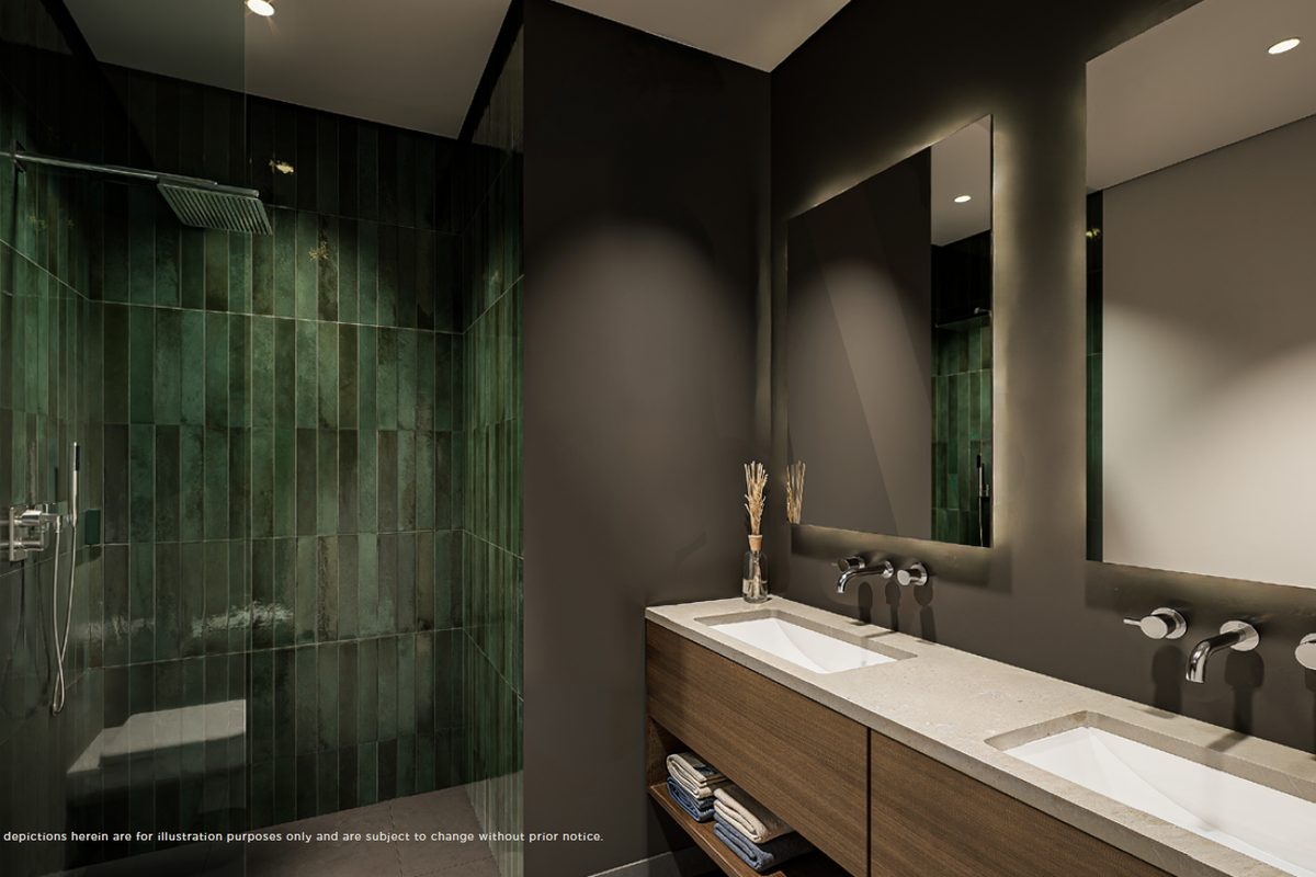 Modern bathroom featuring a double vanity with stone countertop, wall-mounted faucets, backlit mirrors, and a spacious walk-in shower with green feature tiling.