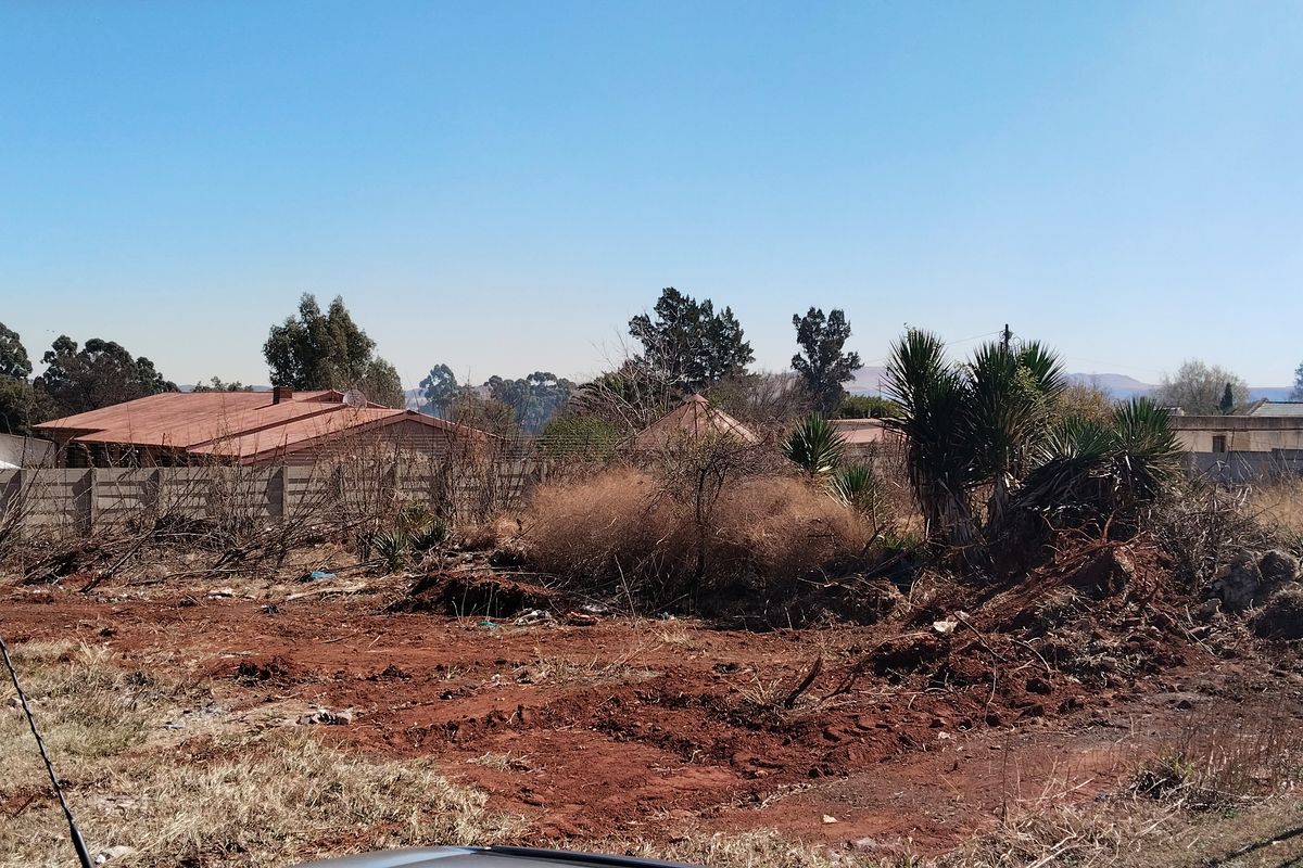 Vacant residential land featuring precast concrete boundary walls and electric fencing, ready for development.