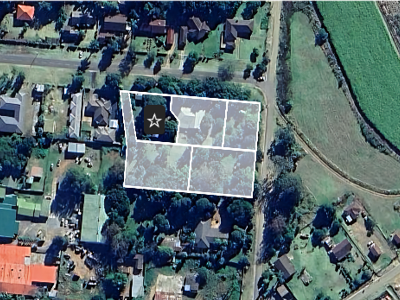 An aerial view showing the property boundaries and surrounding neighborhood context.