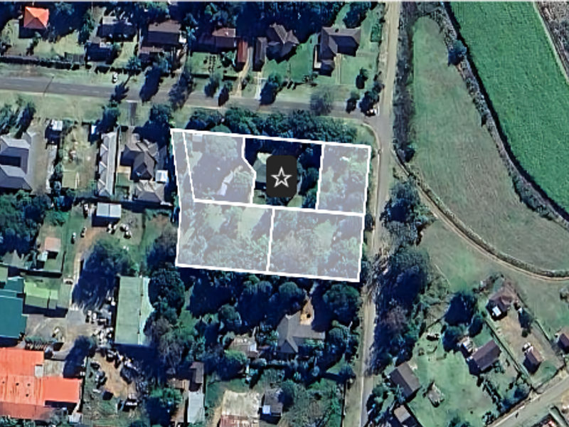 An aerial satellite view showing the property boundaries and surrounding neighborhood layout.