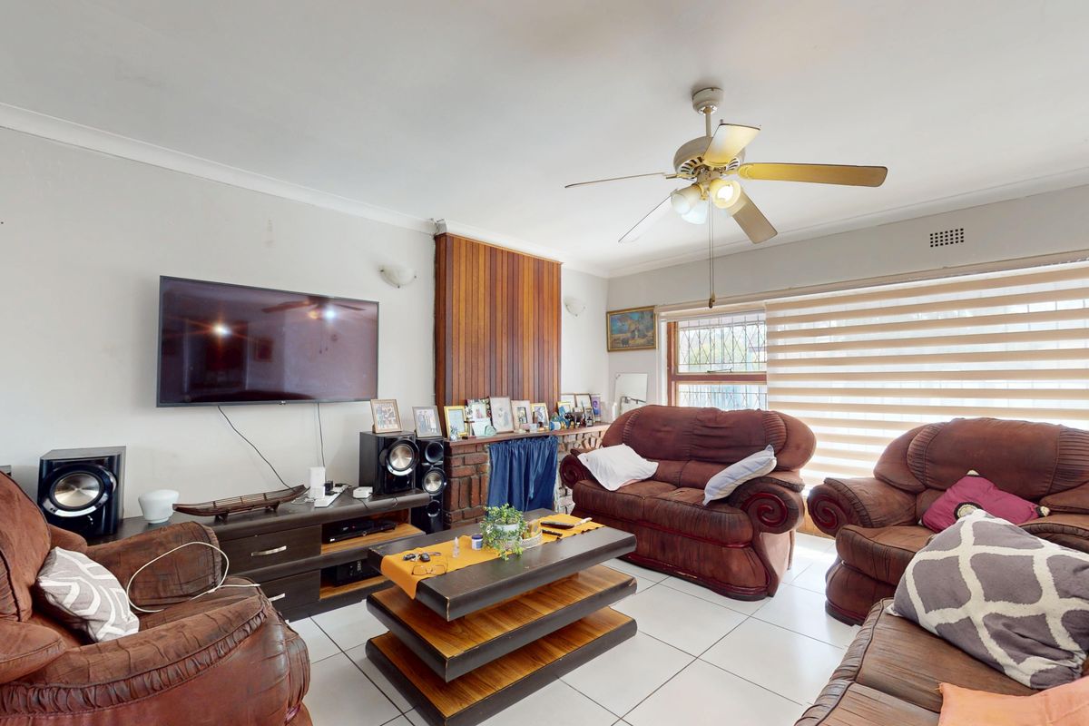 Warm & Welcoming 4-Bedroom Family Home with Entertainment Area and Endless Potential - Photo 2