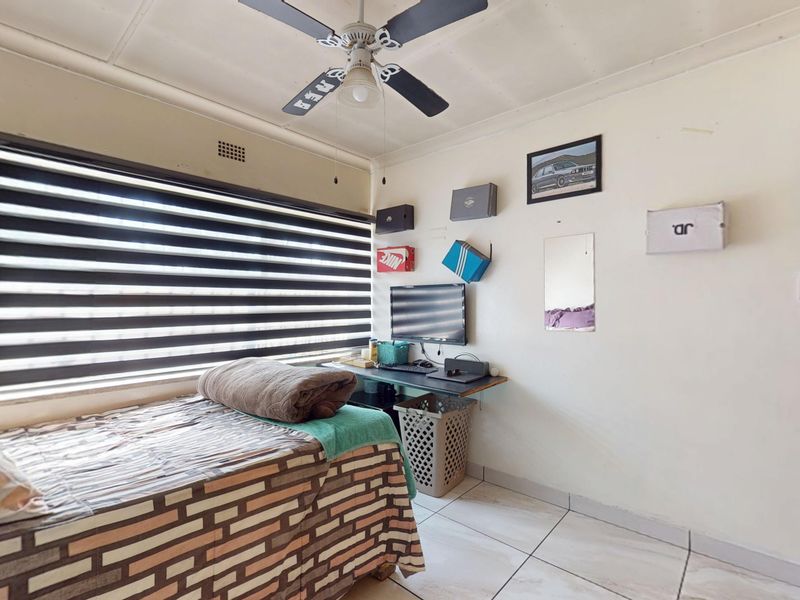 Warm & Welcoming 4-Bedroom Family Home with Entertainment Area and Endless Potential - Photo 8