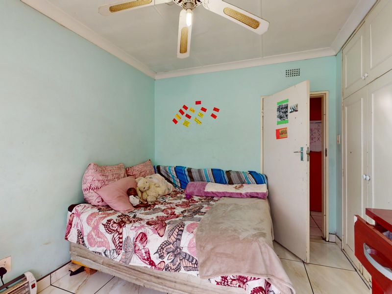 Warm & Welcoming 4-Bedroom Family Home with Entertainment Area and Endless Potential - Photo 7