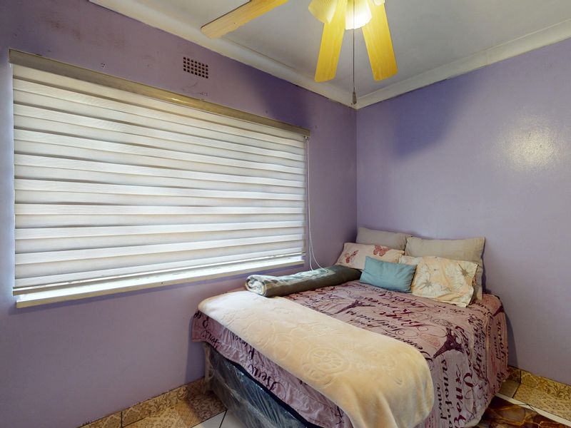 Warm & Welcoming 4-Bedroom Family Home with Entertainment Area and Endless Potential - Photo 6